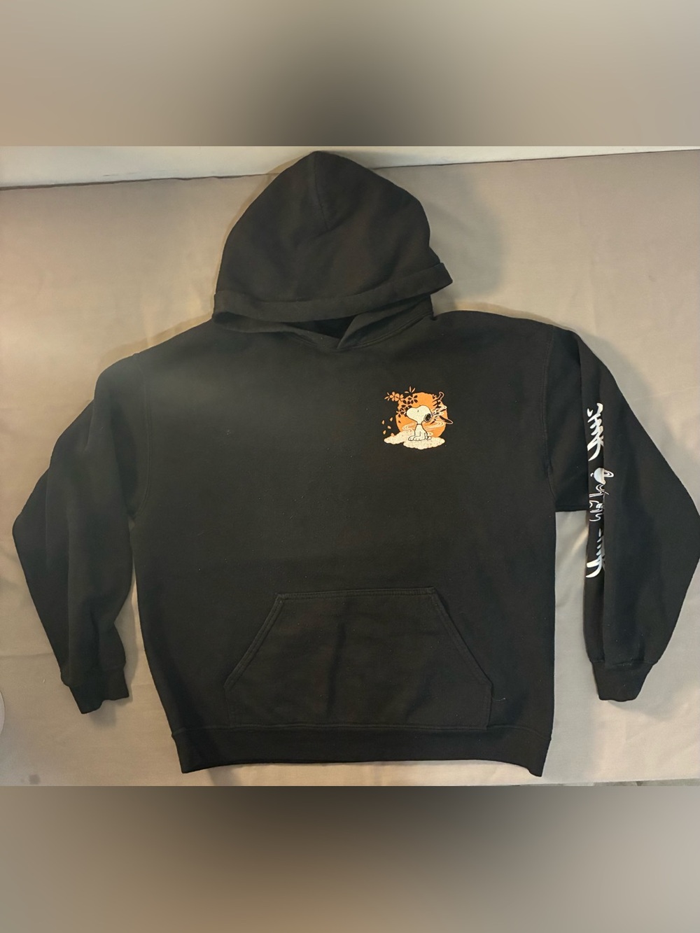 Peanuts Black Hoodie with Orange Snoopy Chest Graphic